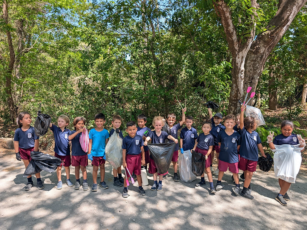 Preschool students picking up trash and learning about the environment