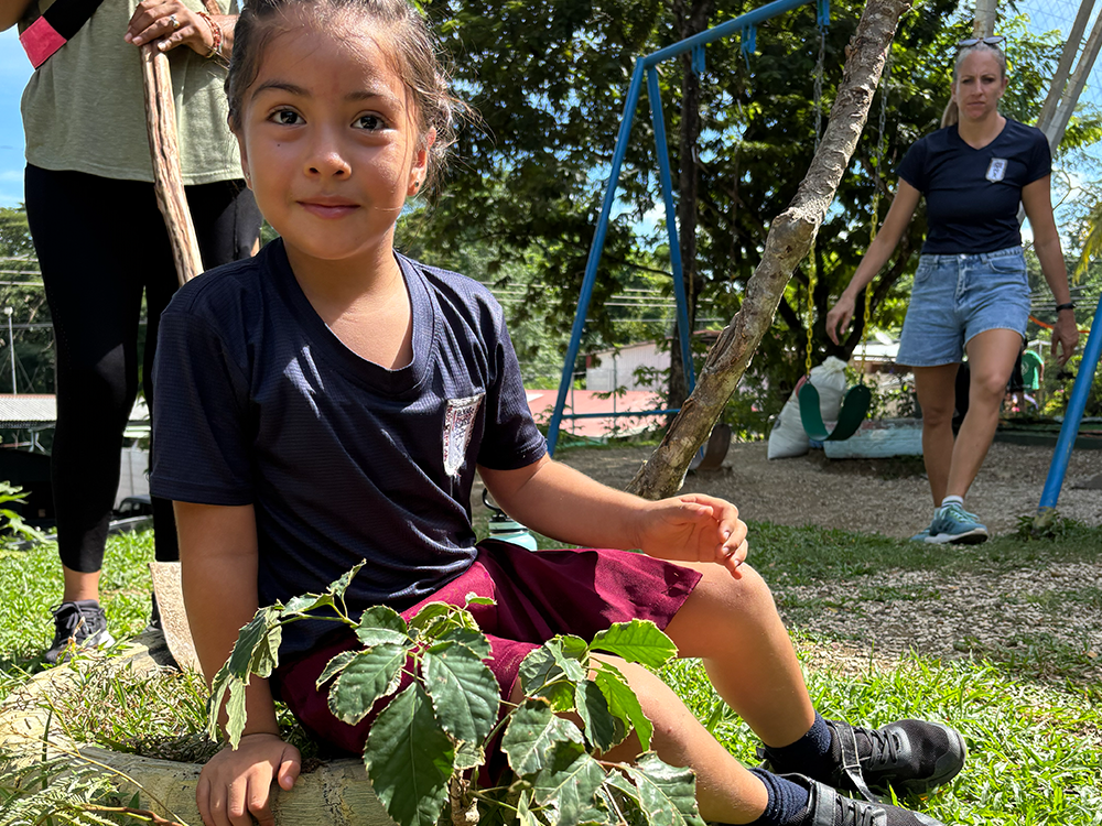 Preschool students picking up trash and learning about the environment