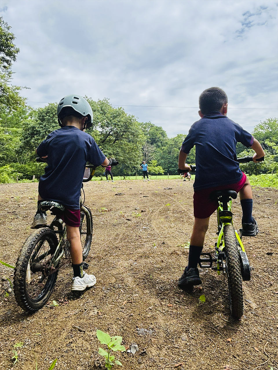 Preschool students participating in a fun bike race activity at Samara Pacific School